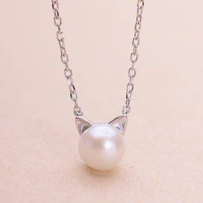 Ketting, oorbellen en ring met katmotief